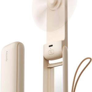 A slim beige portable fan with a built‑in mirror and detachable cover. The fan is shown open with its blades spinning, revealing a USB‑C charging port, power button, and wrist strap for easy carrying. Next to it, the matching cover displays the brand name “Aecooly” and a small logo, highlighting the fan’s compact, travel‑friendly design.