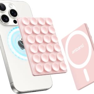 Light pink amBand magnetic suction phone mount set for MagSafe devices, featuring a silicone octo‑cup grip pad with circular suction cups and a matching magnetic plate printed with the amBand logo and ring design. Shown next to a white smartphone with triple camera lenses and blue magnetic alignment glow, illustrating secure attachment and compatibility