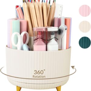 A cream‑colored SKYDUE 360° rotating desk organizer with a ribbed texture and five compartments, standing on three small gold legs. The organizer is filled with colorful stationery items—wooden pencils, pastel pens, scissors, a ruler, and two small hourglass containers. A curved arrow and text reading “360° Rotation” highlight its swivel feature. Three circular color swatches to the right show available options: light pink, beige, and dark teal.