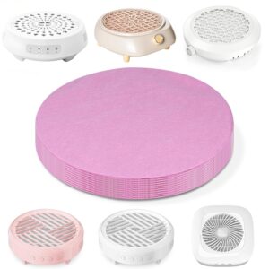 A stack of round pink disposable filter papers sits in the center, surrounded by several models of nail dust collectors in white, beige, and pink. Each collector features a vented top design and control buttons, showing compatibility with the filter sheets for nail dust removal in home or salon setups.
