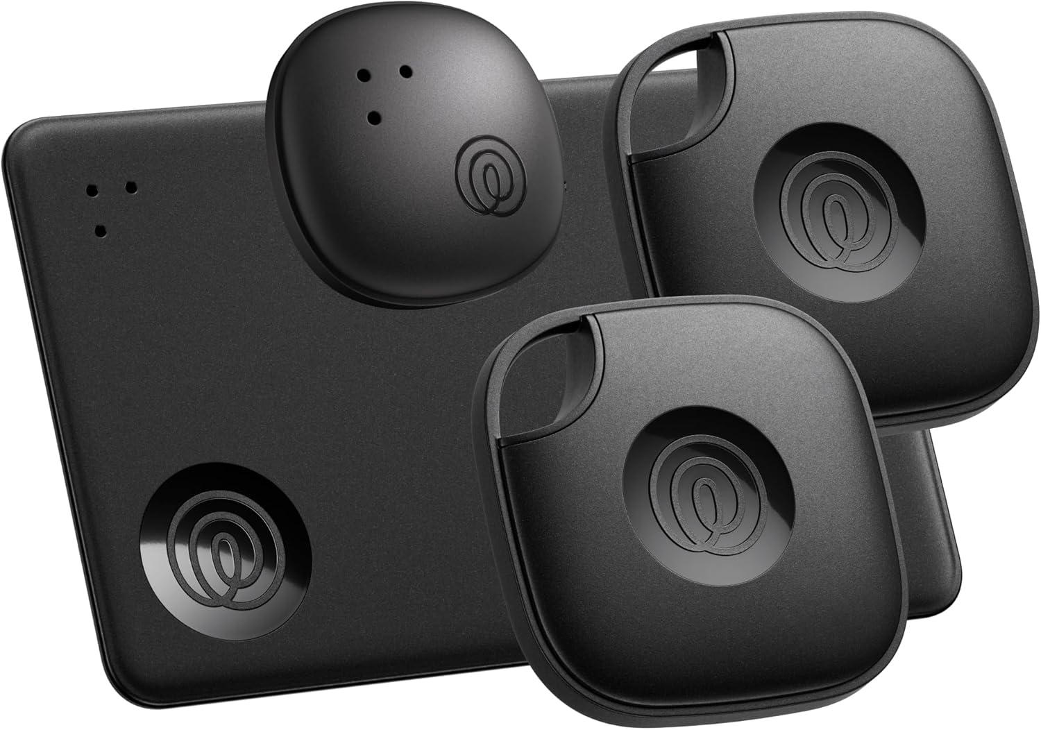 A set of four sleek black Life360 Tile trackers displayed on a white background, including two square devices with rounded edges and keyring holes, one slim rectangular tracker, and one small oval tracker. Each features a glossy circular logo in the center, highlighting their modern design and compact portability for locating everyday items like keys, wallets, and remotes.