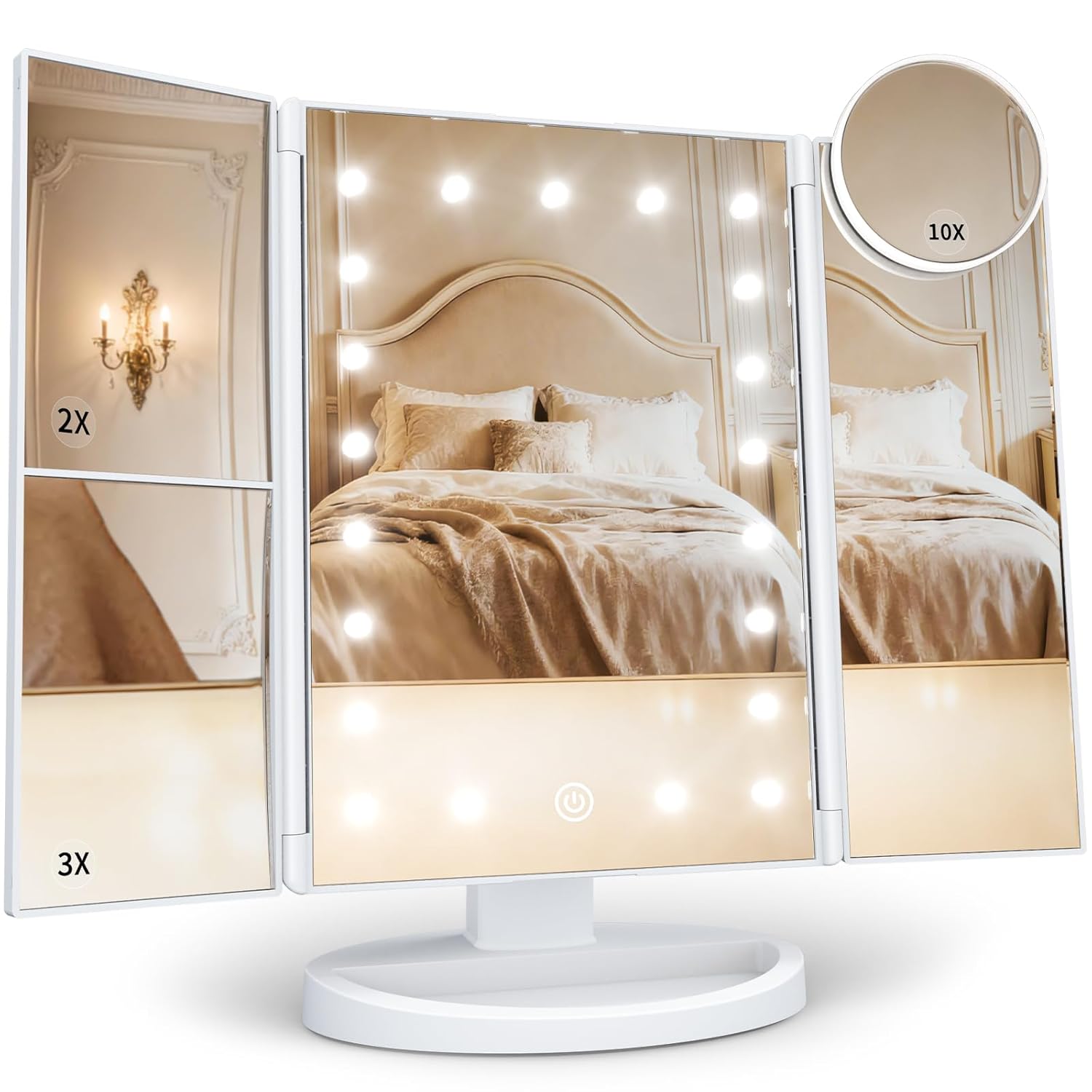 HUONUL trifold vanity mirror with built‑in LED lights around the central panel, mounted on a white base. The left panel shows 2X and 3X magnification sections, while a detachable circular 10X mirror is attached to the upper right corner. The mirror’s reflection displays a beige bedroom with an upholstered headboard, pillows, and wall sconce lighting, highlighting the mirror’s brightness and clarity