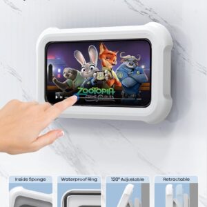 A white waterproof shower phone holder mounted on a bathroom wall with a smartphone inside displaying the movie Zootopia. A hand touches the screen through the clear front panel, demonstrating the sensitive touch feature. Below, four labeled close‑ups highlight the product’s design: soft inside sponge, waterproof sealing ring, 120° adjustable hinge, and retractable mount—showcasing its durable, water‑resistant, and user‑friendly construction.