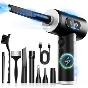 Black handheld electric air duster with LED display showing three speed levels and battery icon, surrounded by multiple cleaning attachments including brushes, narrow nozzles, and a USB‑C charging cable. Blue light streaks illustrate airflow from the nozzle